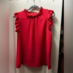 First Love ruffled tank. Small button closure on back at neck. Coral pink